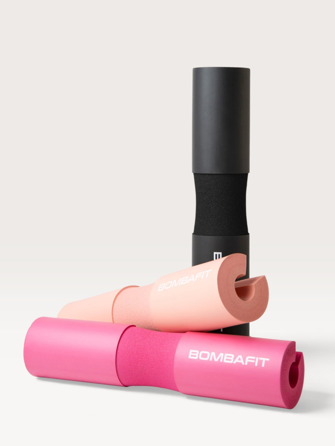 Bilanciere imbottito Bombafit in schiuma protettiva, disponibile nei colori nero, rosa e pesca per sollevamento pesi