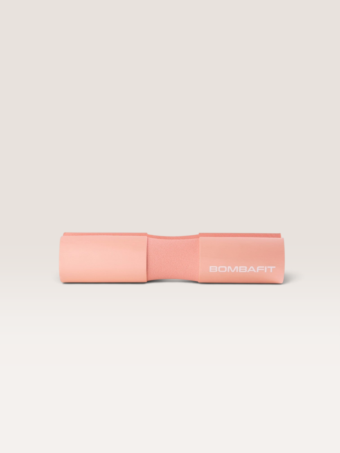Bilanciere imbottito Bombafit di colore rosa per sollevamento pesi, realizzato in schiuma protettiva ergonomica.