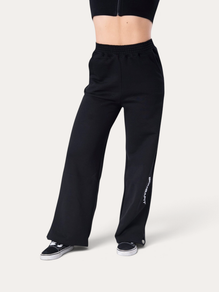 Pantaloni della tuta neri Bombafit Flux a gamba larga con logo bianco sulla gamba e vita elasticizzata