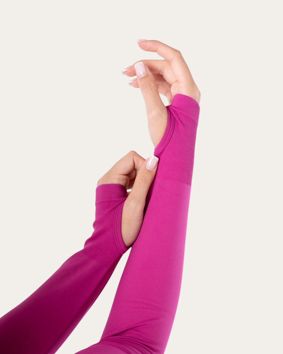 Giacca sportiva a maniche lunghe Bombafit color fucsia con fori per i pollici in tessuto tecnico elasticizzato