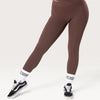 Leggings Bombafit marroni a vita alta con incrocio frontale, tasche laterali e vestibilità compressiva push-up