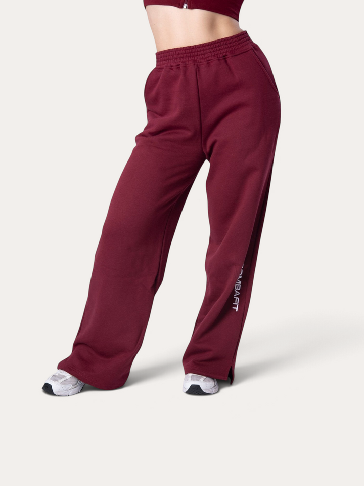 Pantaloni della tuta Bombafit Flux color bordeaux a gamba larga con vita elasticizzata e spacchi laterali
