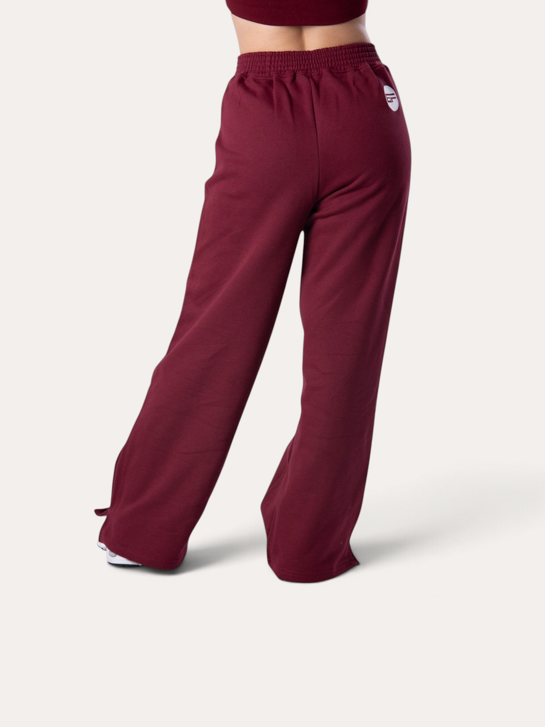 Pantaloni della tuta Bombafit Flux color bordeaux a gamba larga con elastico in vita e logo posteriore