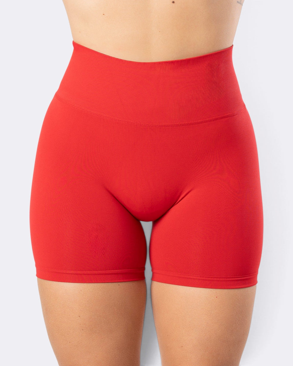 Shorts leggings Bombafit Atena Seamless rosso aurora a vita alta in tessuto tecnico traspirante senza cuciture