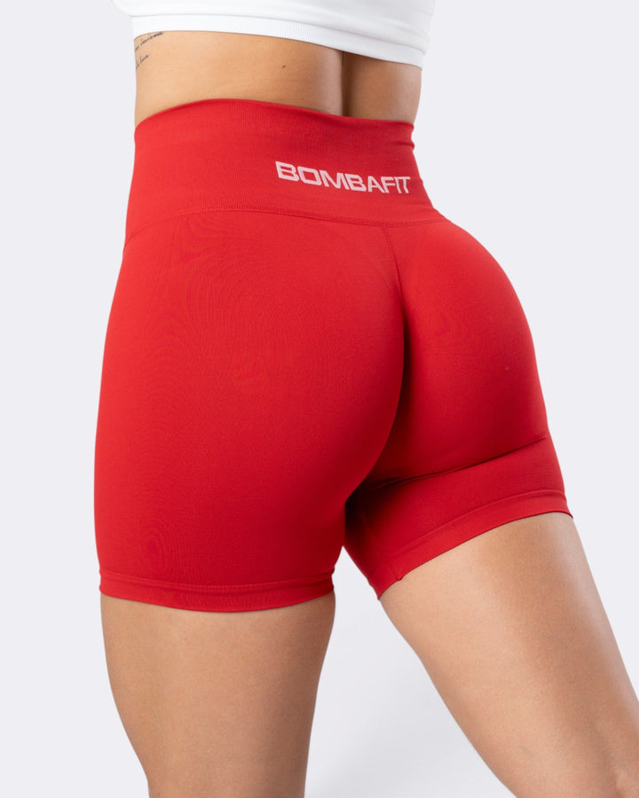 Shorts leggings Bombafit Atena Seamless rosso aurora a vita alta con logo posteriore per fitness e yoga