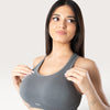 Modella indossa un top sportivo Bombafit Active Seamless color grafite con design senza cuciture e scollo a vogatore